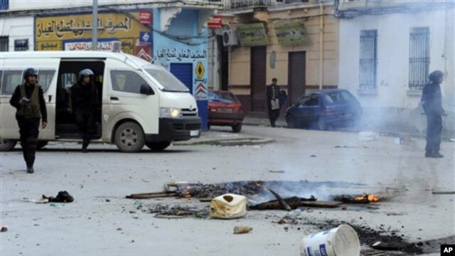 Police patrol in a street in Tunis,  Jan. 13, 2011.
