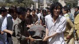 Pakistani Shiite Muslims carry the body of a person killed by gunmen at a local hospital in Quetta, Pakistan, Sept. 1, 2012. 