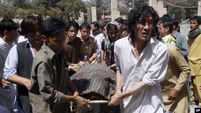 Pakistani Shiite Muslims carry the body of a person killed by gunmen at a local hospital in Quetta, Pakistan, Sept. 1, 2012. 