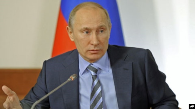 Russian Prime Minister Vladimir Putin attends a meeting of All Russia People's Front, an umbrella movement of his supporters, in Moscow, December 27, 2011.