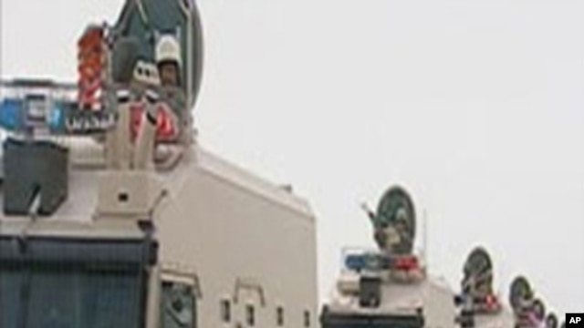 Saudi Arabian troops cross the causeway leading to Bahrain in this still image taken from video, March 14, 2011
