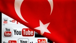 YouTube logos displayed on a laptop screen partially covered with Turkey's national flag in this photo illustration taken in Ankara, March 27, 2014.  