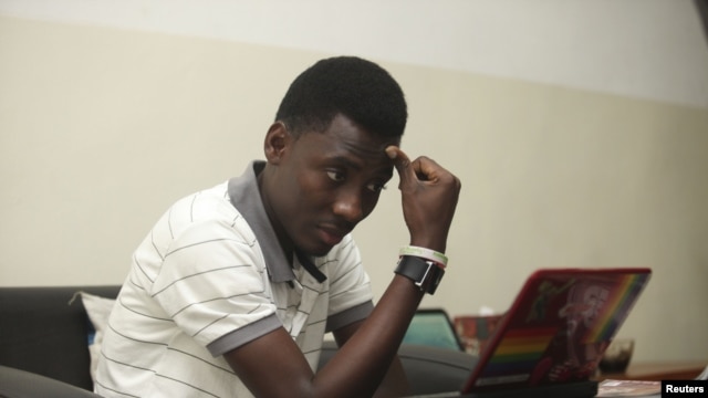 Rashidi Williams, a gay man, works on his laptop in Lagos, Nigeria, in this Nov. 17, 2011 photo. 