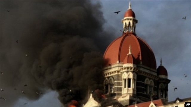 This file photograph taken on 27 Nov 2008 shows flames gushing out of The Taj Mahal Hotel in Mumbai, one of the sites attacked by alleged militant gunmen