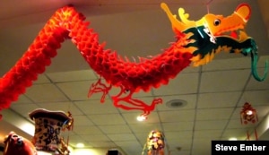 Chinatown restaurant dragon hovers above diners