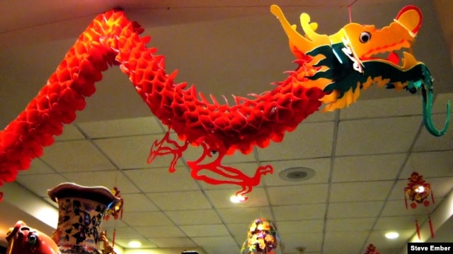 Chinatown restaurant dragon hovers above diners