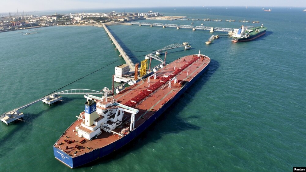 FILE - A crude oil importing port in Qingdao, Shandong province, China.
