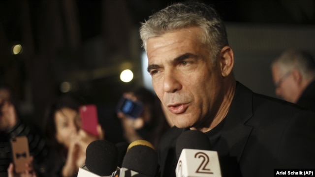 Yair Lapid, leader of Yesh Atid party gives a statement outside his home in Tel Aviv, Wednesday, Jan. 23, 2013.  (AP Photo/Ariel Schalit)