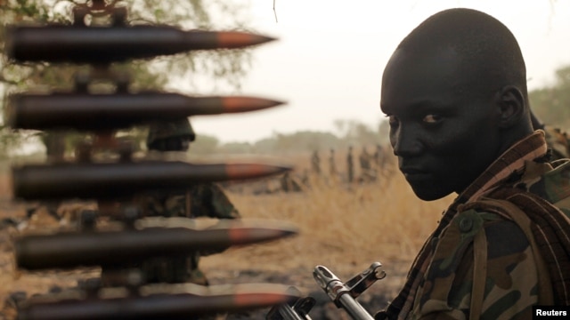 A South Sudan's army, or the SPLA, soldier sits in a truck on the frontline in Panakuach, Unity State,April 24, 2012. 