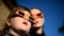 A child (L) watches a partial solar eclipse with a woman at the Sydney Observatory. Star-gazers were treated to an annular solar eclipse in remote areas of Australia with the moon crossing in front of the Sun and blotting out much of its light.