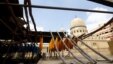 Colored yarns are hung up to dry on the roof of a dye workshop in old Cairo, Egypt, March 17, 2016. 