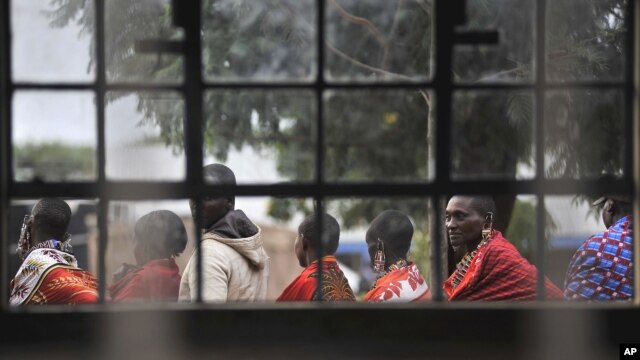 Masaai line up to vote in a general election outside an elementary school in Kumpa, Kenya, March 4, 2013.
