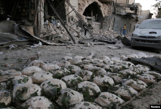 Stacks of bread are seen at a damaged site after an airstrike in the rebel-held Bab al-Maqam neighbourhood of Aleppo, Syria, Sept. 28, 2016.