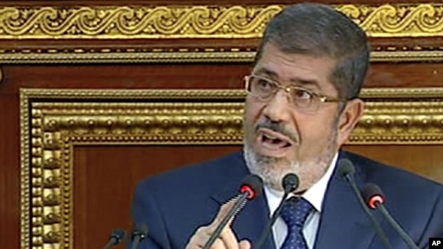 Image from Egyptian State Television shows Egyptian President Mohammed Morsi speaking at the Shura Council, the country's upper house of parliament, Cairo, December 29, 2012.