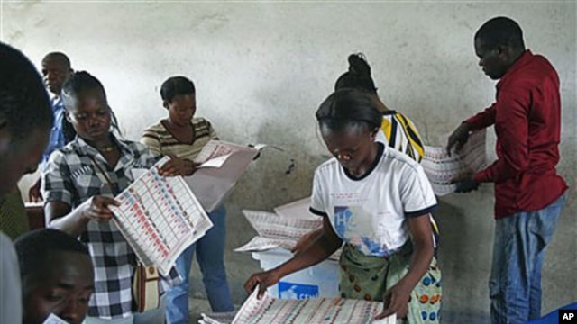 Electoral commission workers tally ballots at a polling station in the Bandal commune, one day after the country went to the polls for presidential and parliamentary elections, Kinshasa, Democratic Republic of Congo, November 29, 2011.