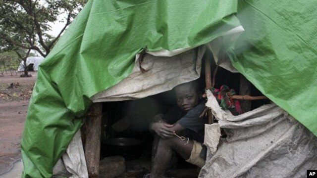 An internally displaced boy takes shelter from the rain at Kabo camp in northern Central African Republic. (File Photo)