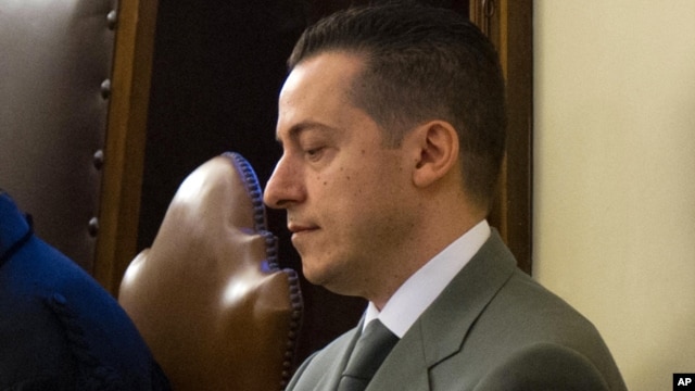 Pope's butler Paolo Gabriele sits in the wood-trimmed courtroom of the Vatican tribunal allegedly for stealing and leaking papal correspondence to a journalist, Sept. 29, 2012.