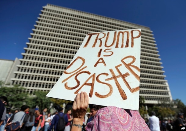 Students from several high schools rally after walking out of classes to protest the election of Donald Trump as president in downtown Los Angeles Monday, November. 14, 2016.