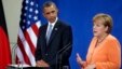 U.S. President Barack Obama listens as German Chancellor Angela Merkel addresses the media during a press conference at the chancellery in Berlin, June 19, 2013.