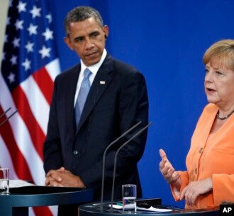 Presiden AS Barack Obama (kiri) dan Kanselir Jerman Angela Merkel di Berlin, Rabu (19/6). 
