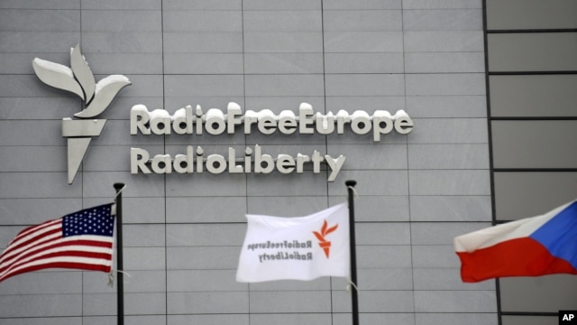 The headquarters of Radio Free Europe/Radio Liberty (RFE/RL) is seen with the United States, RFE/RL and the Czech Republic flags in the foreground, in Prague, January 15, 2010.