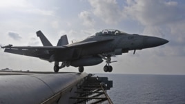 Phi cơ tiêm kích F/A-18F Super Hornet cất cánh từ Hàng không Mẫu ham USS George Washington
