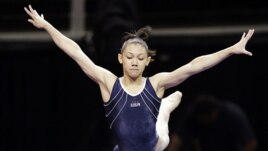 Kyla Ross leaps from the balance beam during practice for the U.S. Olympic gymnastics trials, June 27, 2012, in San Jose, California.