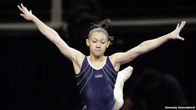 Kyla Ross leaps from the balance beam during practice for the U.S. Olympic gymnastics trials, June 27, 2012, in San Jose, California.