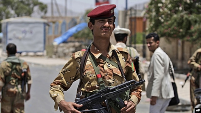 A Yemeni army officer stands at a checkpoint in Sana'a, Yemen, June 9, 2011