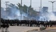 Riot police take position and fire tear gas at protesters gathering near Castelao stadium in Fortaleza, Brazil, June 19, 2013. 