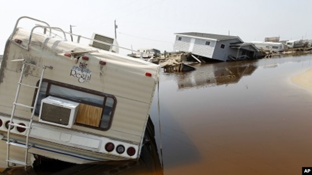 A trailer sits on the beach at the North Beach Campground after being washed out by Hurricane Irene, at Cape Hatteras National Seashore in Rodanthe, North Carolina August 29, 2011.