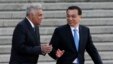 Sri Lanka's Prime Minister Ranil Wickremesinghe, (l) chats with Chinese Premier Li Keqiang during a welcome ceremony outside the Great Hall of the People in Beijing, April 7, 2016.