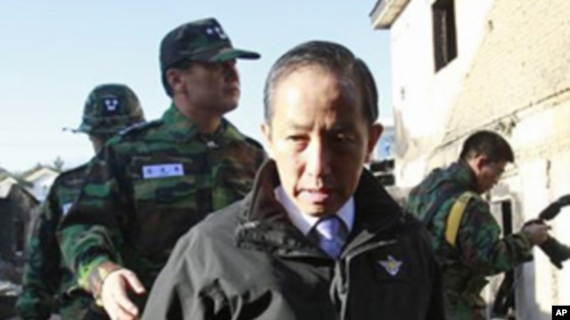 South Korean Defense Minister Kim Tae-young, who has resigned, looks at the destroyed houses on Yeonpyeong Island, South Korea, Nov. 25, 2010.