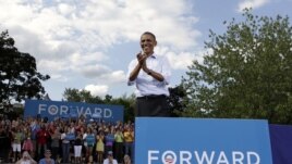 U.S. President Barack Obama reacts to supporters during a campaign event in Rochester, New Hampshire, August 18, 2012.