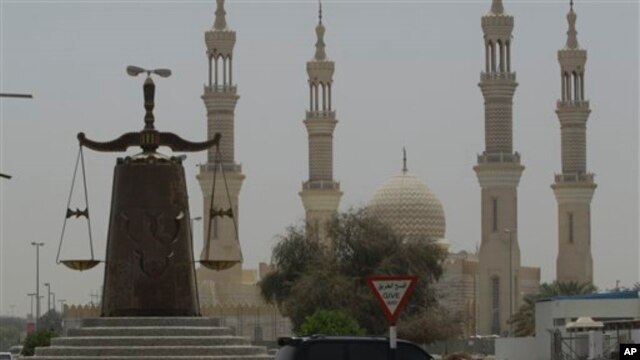 Justice monument in front of a mosque in Ras al Khaimah, United Arab Emirates, May 3, 2012.
