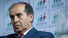 Libyan politician Mahmoud Jibril talks to journalists in Tripoli Aug. 8, 2012.