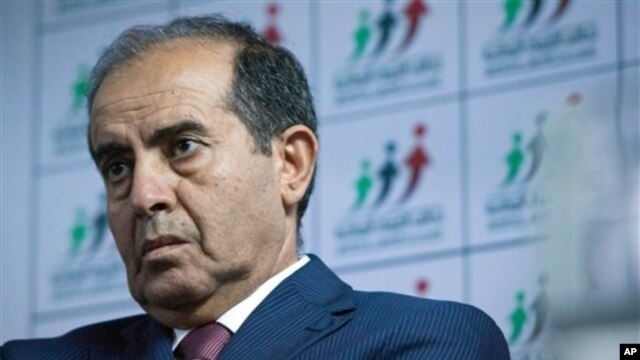 Libyan politician Mahmoud Jibril talks to journalists in Tripoli Aug. 8, 2012.