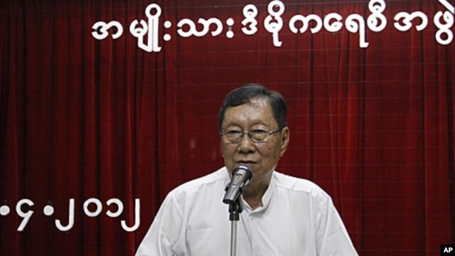 Top National League for Democracy (NLD) official Nyan Win talks to reporters after a meeting at the party's head office in Rangoon, April 20, 2012.