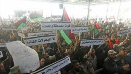 Members of the Libyan National Army rally to call for the National Transitional Council to stop marginalizing the role of the national army in Benghazi, Libya, March 4, 2012. 