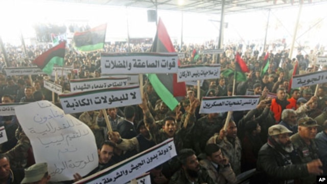 Members of the Libyan National Army rally to call for the National Transitional Council to stop marginalizing the role of the national army in Benghazi, Libya, March 4, 2012. 