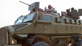 Uganda People's Defence Force troops ride through the streets of Bor, Jonglei State, on January 19 during South Sudan's month-long internal conflict.