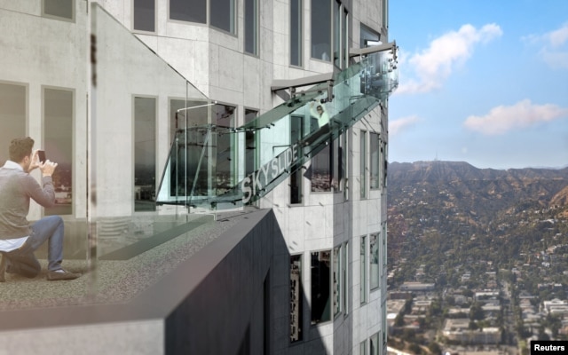 An artist rendering of the "Skyslide" attraction, an outdoor glass slide positioned close to 1,000 feet above downtown Los Angeles, California, is shown in this image released by OUE Skyspace, March 2, 2016.