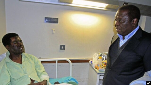 Zimbabwe's Prime Minister Morgan Tsvangirai visits Movement for Democratic Change [MDC] youth leader Yaya Kassim - who was attacked while visiting MDC supporters, allegedly by youths loyal to President Robert Mugabe's ZANU PF party - at a hospital in the 