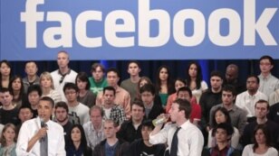 President Barack Obama, accompanied by Facebook CEO Mark Zuckerberg, speaks during a town hall meeting to discuss reducing the national debt at Facebook headquarters in Palo Alto, California, April 20, 2011.