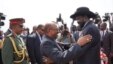 South Sudanese President Salva Kiir (r.) hugs his Sudanese counterpart Omar al Bashir as he arrives at Juba airport on Friday, April 12, 2013. The Sudanese president was visiting South Sudan for the first time since it split from Sudan in 2011.