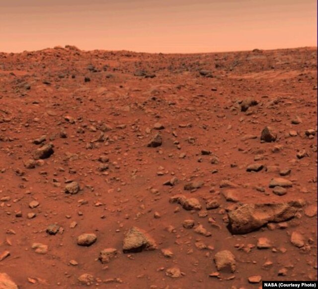 First color image of Mars taken by Viking 1 on July 21, 1976. The original image was calibrated incorrectly showing a blue sky instead of a red one. A correctly calibrated image was released on July 26th 1976.