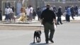 FILE - Inmates exercise, under guard, in the main yard at California State Prison in Vacaville, May 20, 2015.