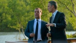 Norwegian Prime Minister Jens Stoltenberg (R) speaks to his Russian counterpart Dmitry Medvedev as a part of the Barents Summit 2013 in Kirkenes, Norway, June 3, 2013.