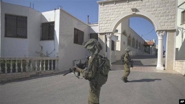 Israeli soldiers patrol in the village of Ghajar between northern Israel and Lebanon, 10 Nov 2010
