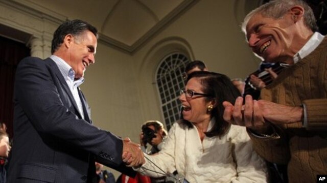 Republican presidential candidate and former Massachusetts Governor Mitt Romney greets audience members at a campaign stop in Peterborough, New Hampshire January 4, 2012, one day after winning the Iowa caucus.